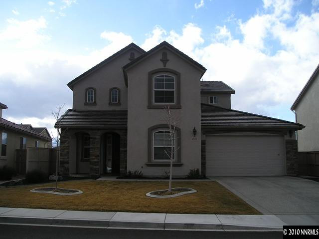 2570 Country Falls Lane Reno, NV 89521 - Photo 1 of 9 a front view of a house with garden