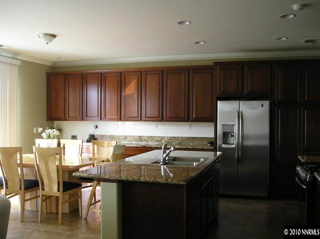 2570 Country Falls Lane Reno, NV 89521 - Photo 2 of 9 a kitchen with a sink cabinets and stainless steel appliances