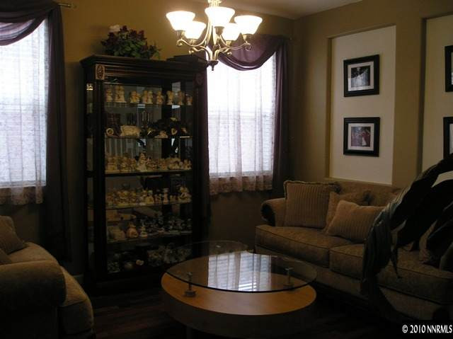 2570 Country Falls Lane Reno, NV 89521 - Photo 3 of 9 a living room with furniture and a chandelier