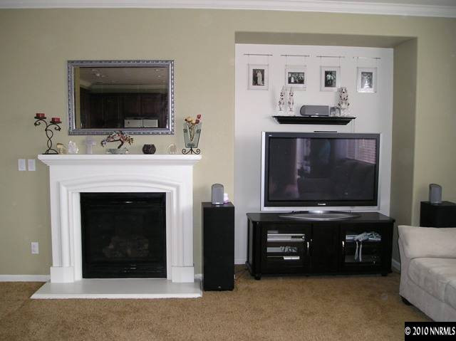 2570 Country Falls Lane Reno, NV 89521 - Photo 4 of 9 a living room with furniture and a fireplace