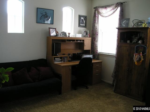 2570 Country Falls Lane Reno, NV 89521 - Photo 5 of 9 a living room with furniture and a fireplace