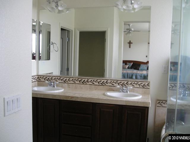 2570 Country Falls Lane Reno, NV 89521 - Photo 6 of 9 a bathroom with a sink and a mirror