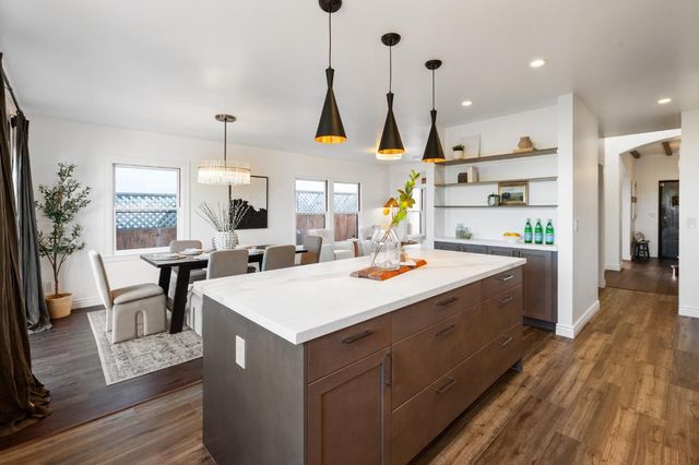 a view of kitchen with wooden floor