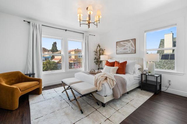 a bed room with a bed and a couch