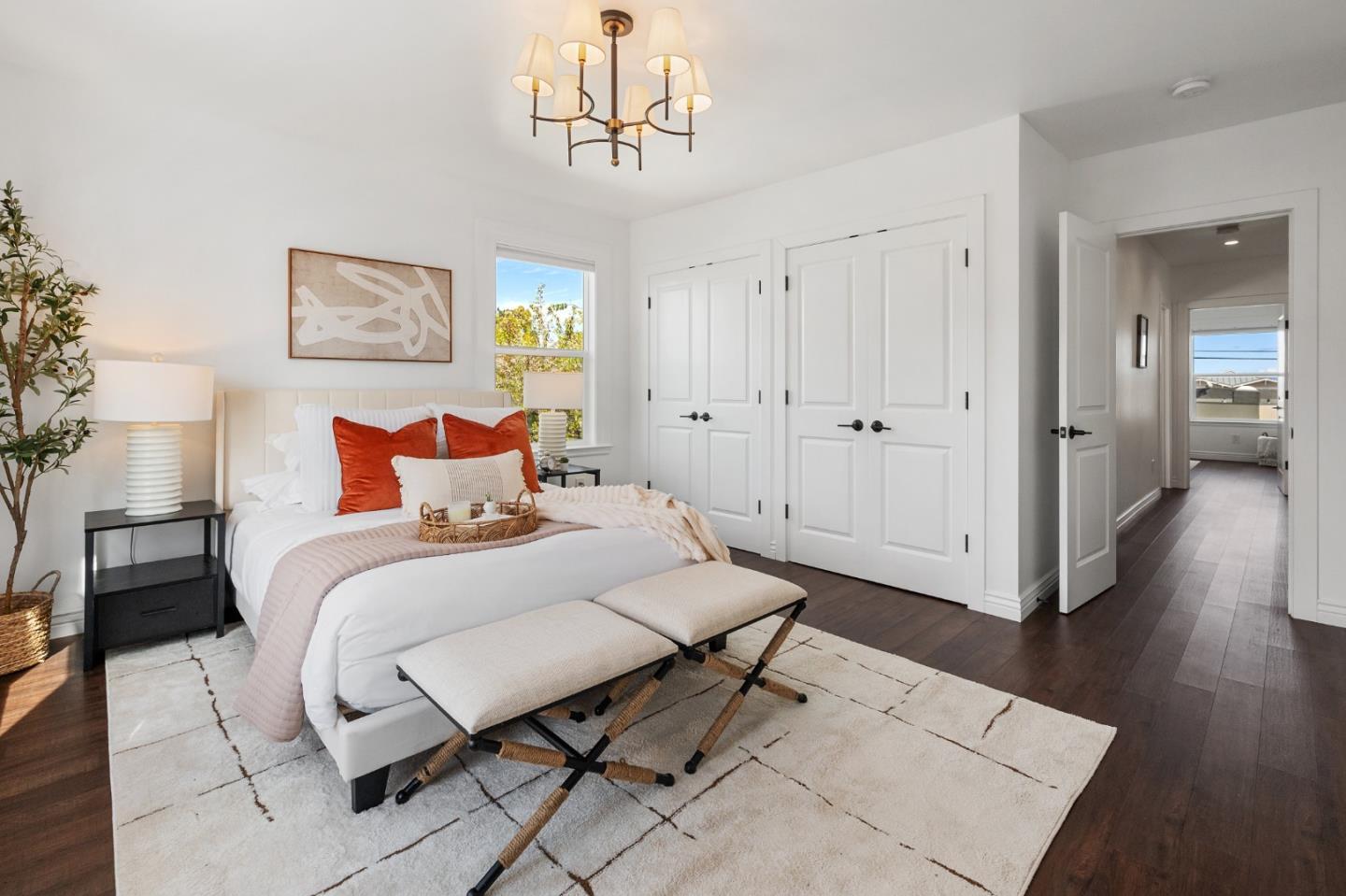 260 Willow Avenue Millbrae, CA 94030 - Photo 22 of 31 a bedroom with a bed and a chandelier