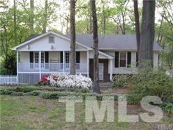 5809 Timber Ridge Drive Raleigh, NC 27609 - Photo 1 of 3 a front view of a house with garden