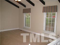 5809 Timber Ridge Drive Raleigh, NC 27609 - Photo 3 of 3 a view of an empty room with a window