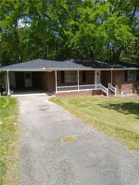 68 Bell Street Temple, GA 30179 - Photo 1 of 1 a swimming pool with outdoor seating and yard