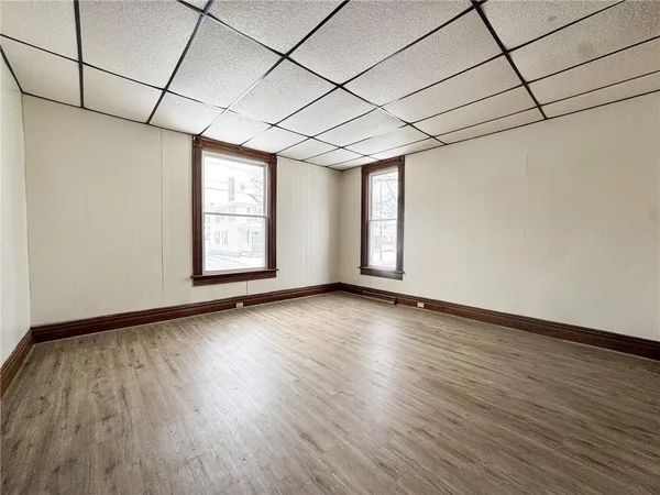 a view of hallway with wooden floor