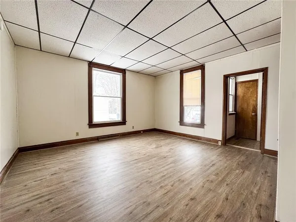 a kitchen with stainless steel appliances a stove a refrigerator and a microwave