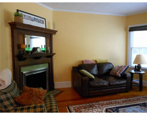 89 Malbone Road Newport, RI 02840 - Photo 7 of 20 Living Room. Beautiful hardwoods in sunny living room with fireplace.