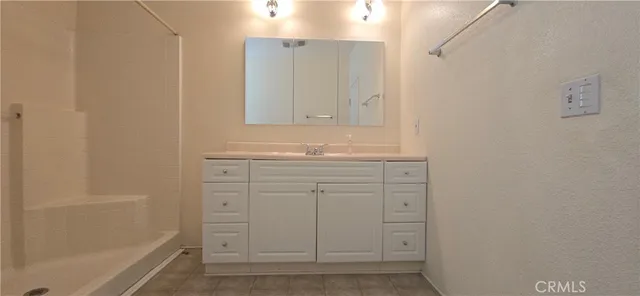 a bathroom with a toilet sink and shower