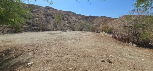 a view of a pathway with a yard