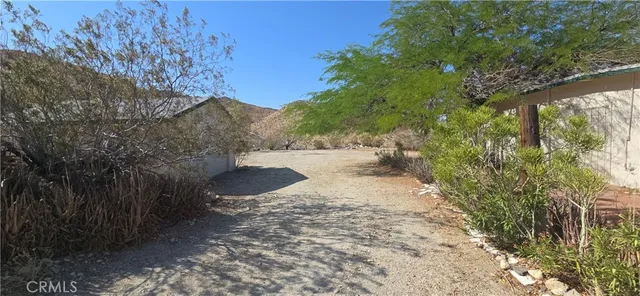 a view of a back yard of the house