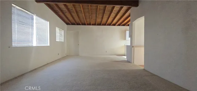 a view of empty room with windows