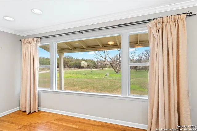 a view of a room that has a large window