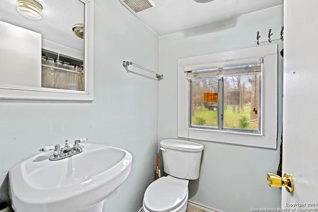 a bathroom with a sink and a toilet