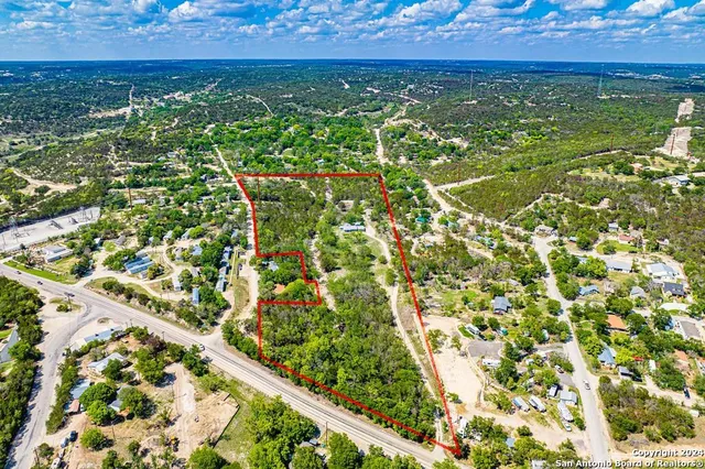 a view of a park with large trees