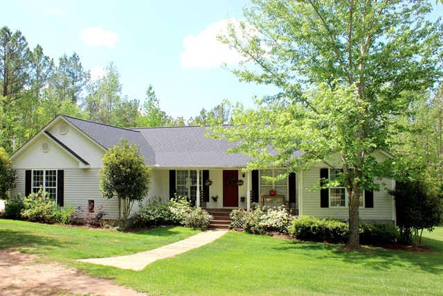 1935 Reedy Creek Road Forsyth, GA 31029 - Photo 1 of 14 a front view of a house with a yard and porch