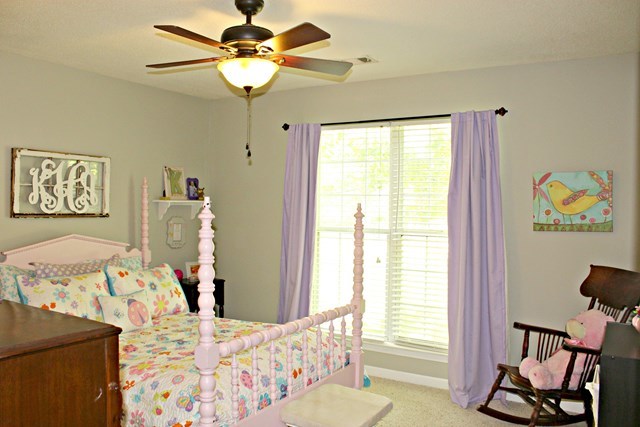 1935 Reedy Creek Road Forsyth, GA 31029 - Photo 9 of 14 a bedroom with a bed and a chandelier