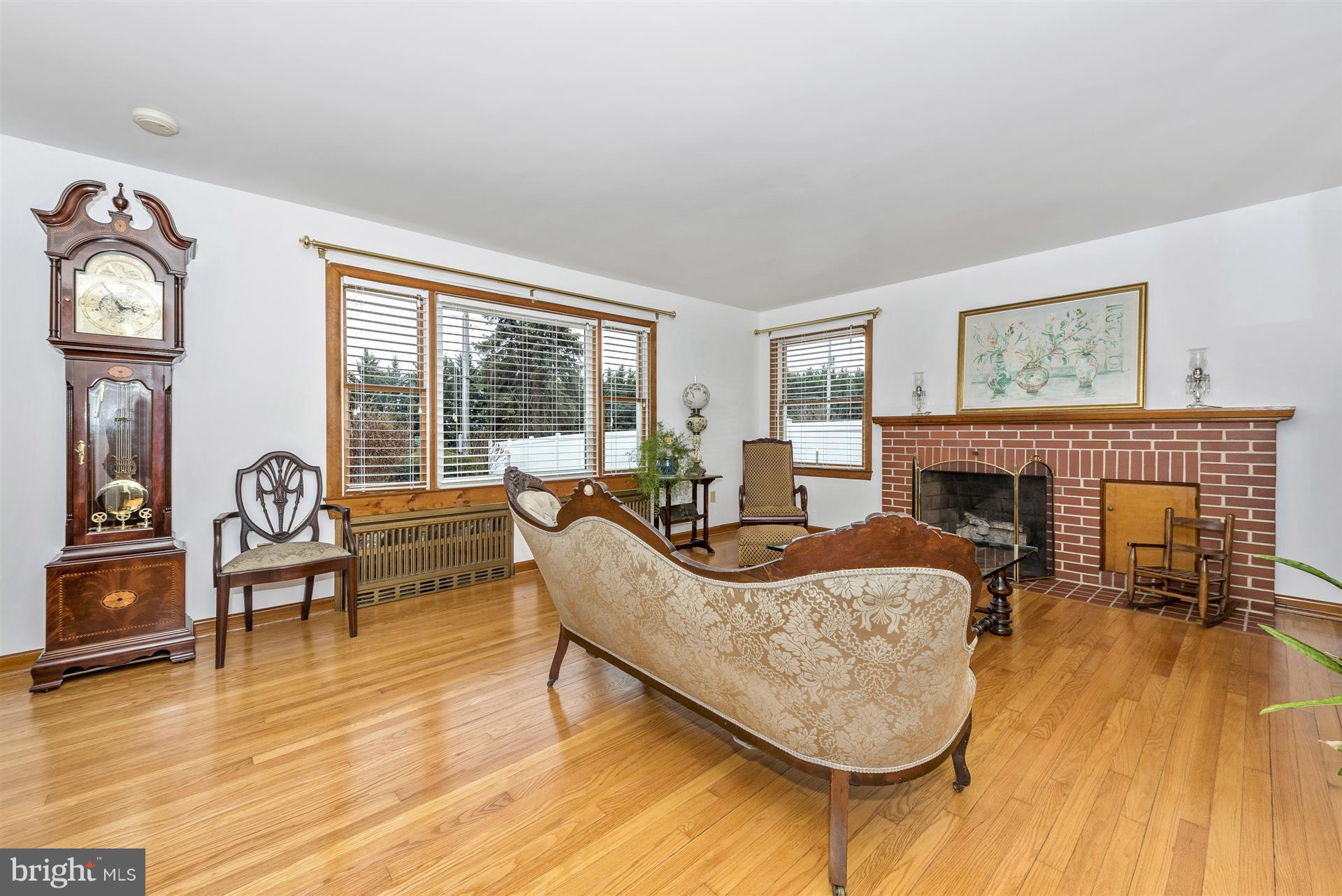 6014 Ridge Road Mount Airy, MD 21771 - Photo 21 of 30 Living Room fireplace, original hardwood floors