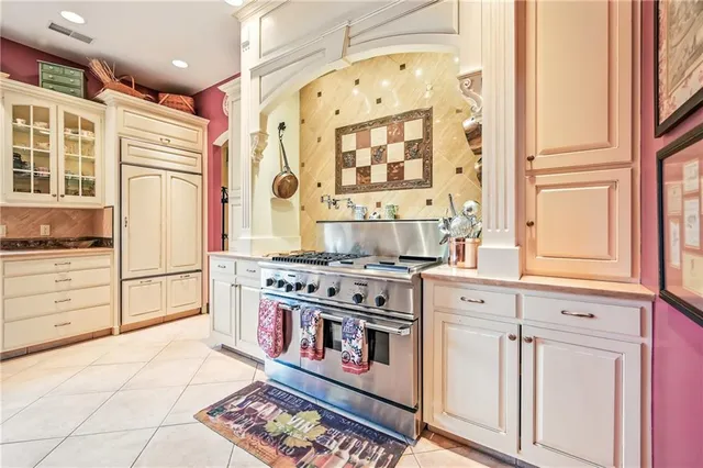 a kitchen with stainless steel appliances a stove and a refrigerator