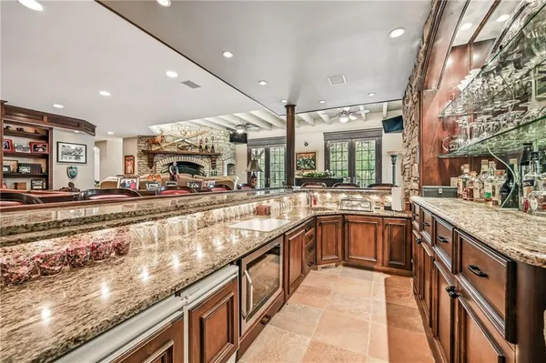 a kitchen with stainless steel appliances granite countertop a sink and cabinets