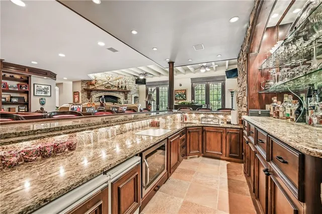 a kitchen with stainless steel appliances granite countertop a sink and cabinets