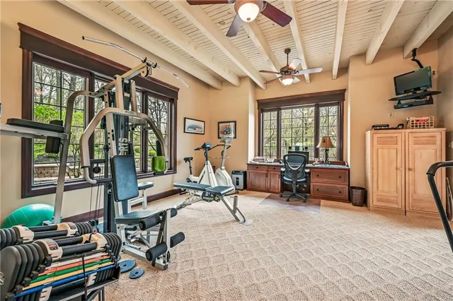 a view of a livingroom with furniture and a floor to ceiling window