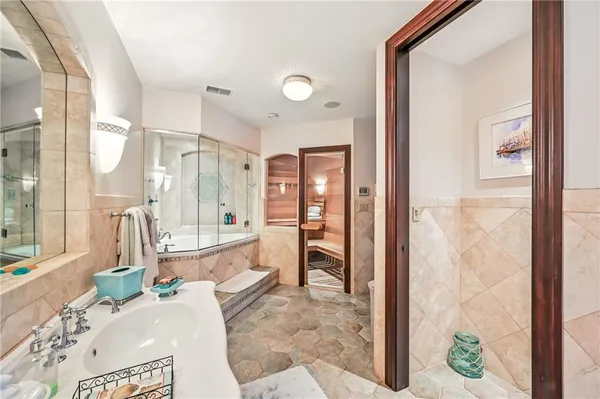 a living room with a large window and furniture