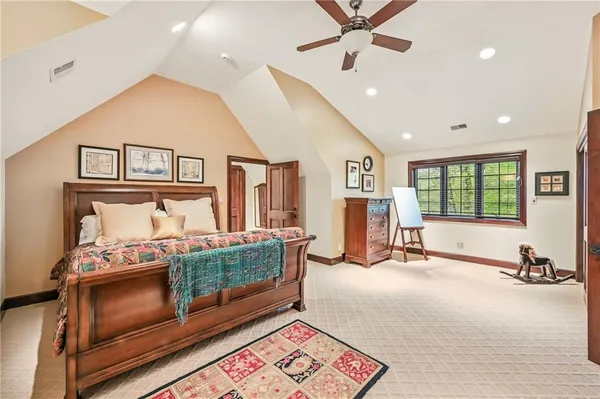 a bed room with a bed and a tv