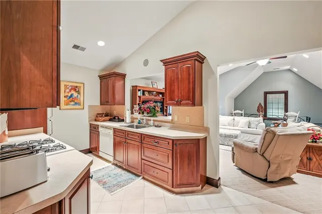 a kitchen with a stove and a refrigerator
