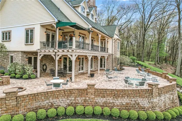 a view of a house with yard and sitting area