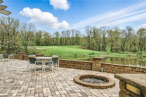 a view of a swimming pool with a patio