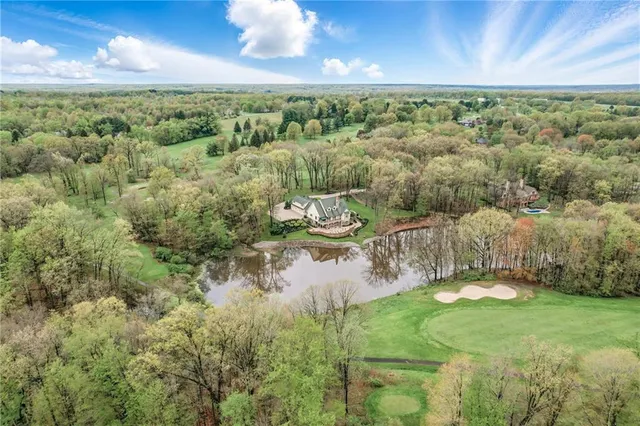 a view of a lake with a yard