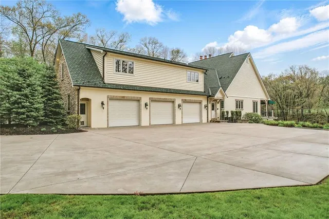 a view of an house with backyard space and garden