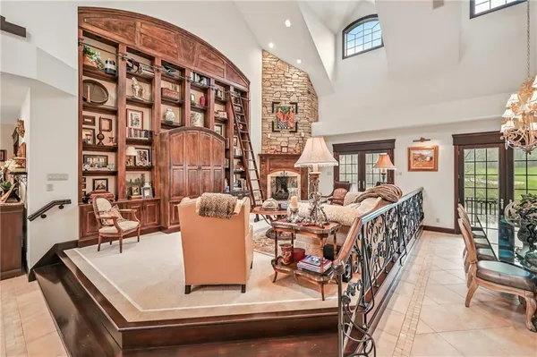 a living room with furniture and outdoor space