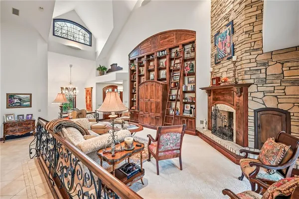 a balcony view with furniture and fireplace