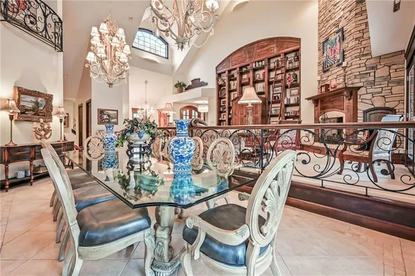 a view of a dining room with furniture and chandelier