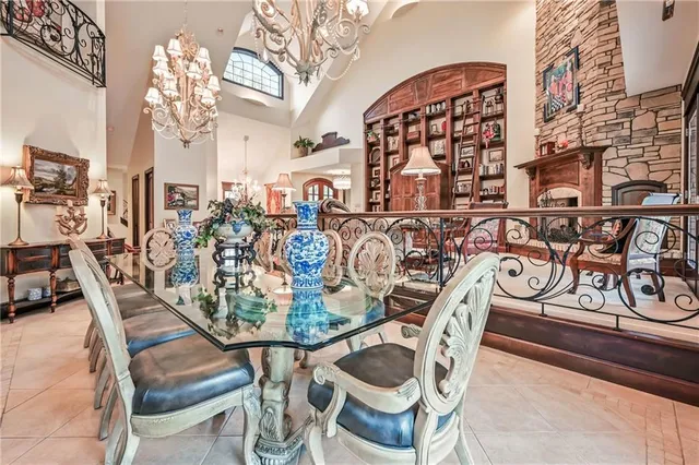 a view of a dining room with furniture and chandelier