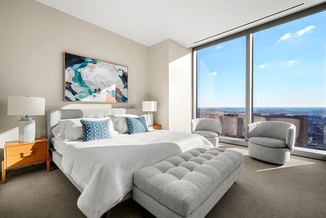 a bedroom with bed and a couch