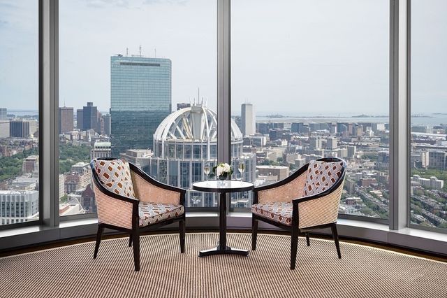 a room with furniture wooden floor and a table