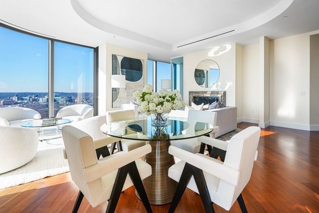 a dining room with furniture and wooden floor