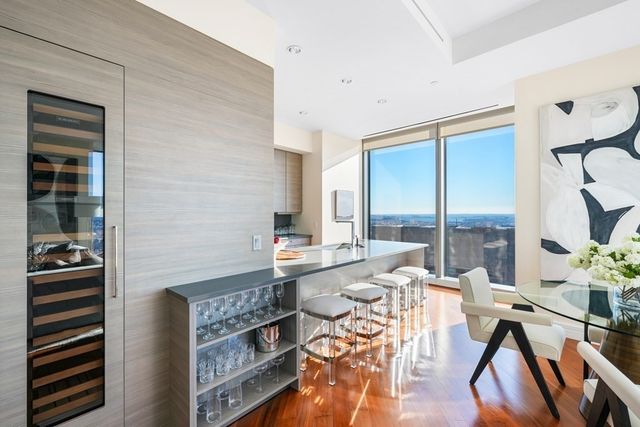 a room with furniture a rug and a window