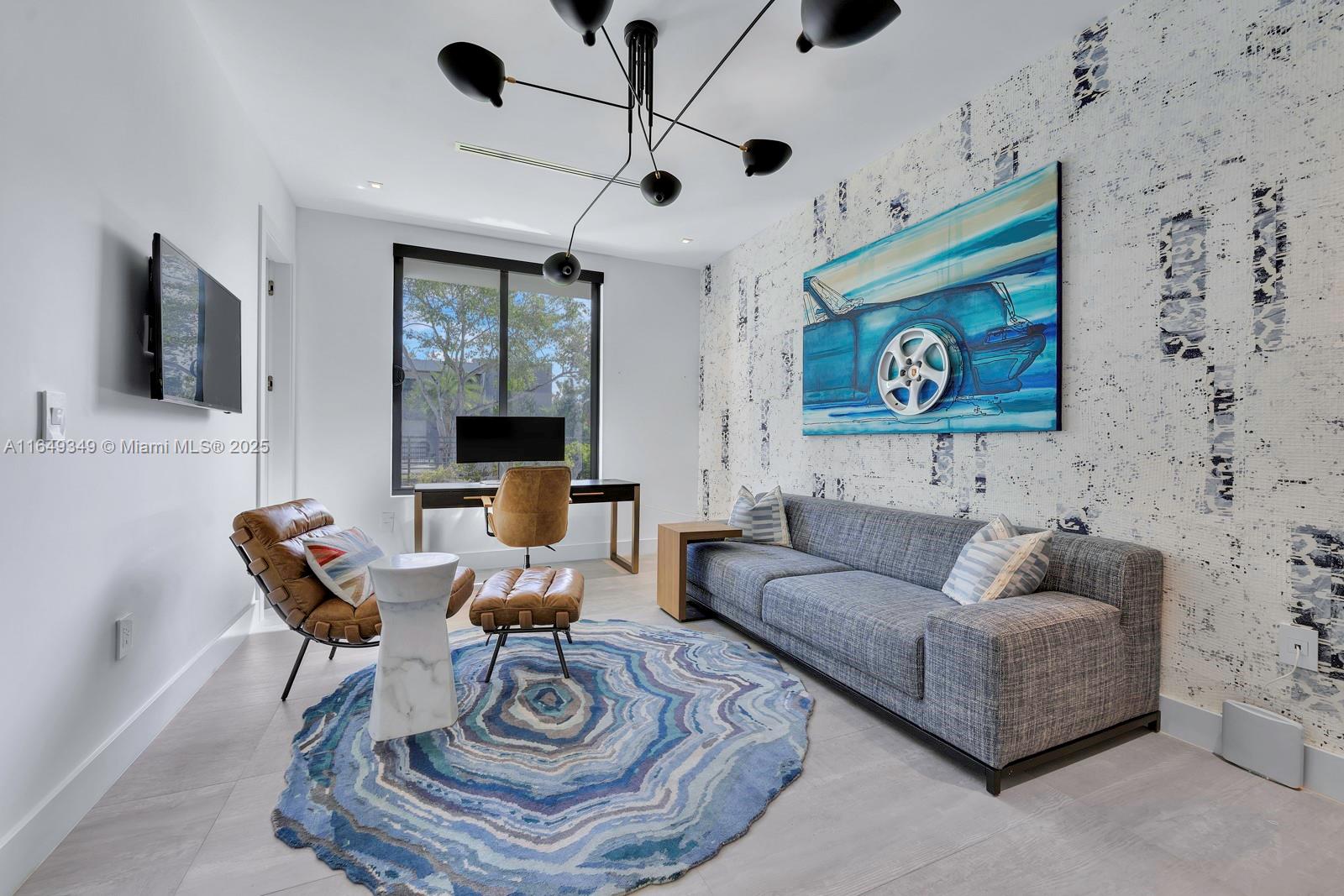 7900 Southwest 54th Avenue Miami, FL 33143 - Photo 13 of 63 a living room with furniture and a flat screen tv