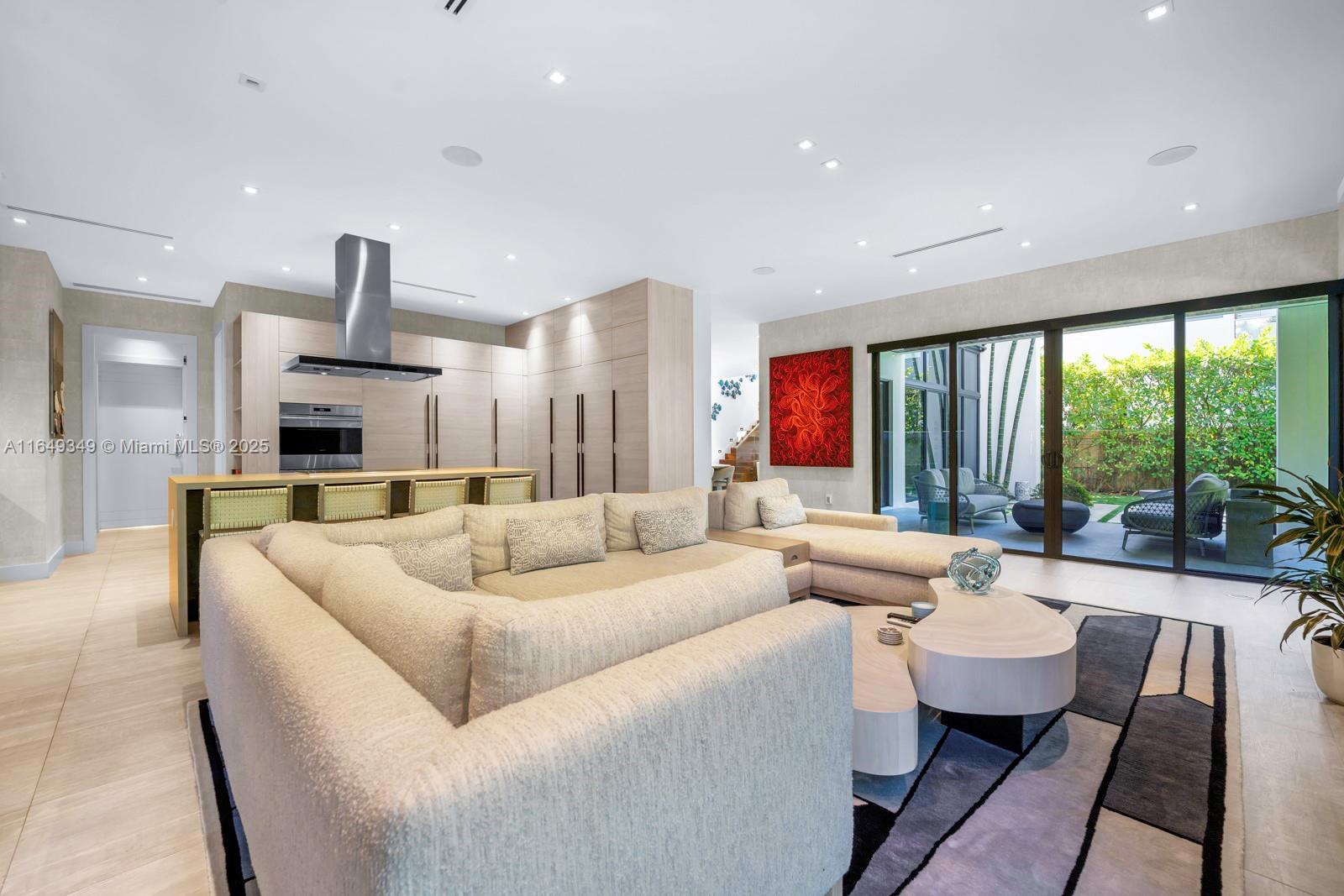 7900 Southwest 54th Avenue Miami, FL 33143 - Photo 19 of 63 a living room with furniture and a large window
