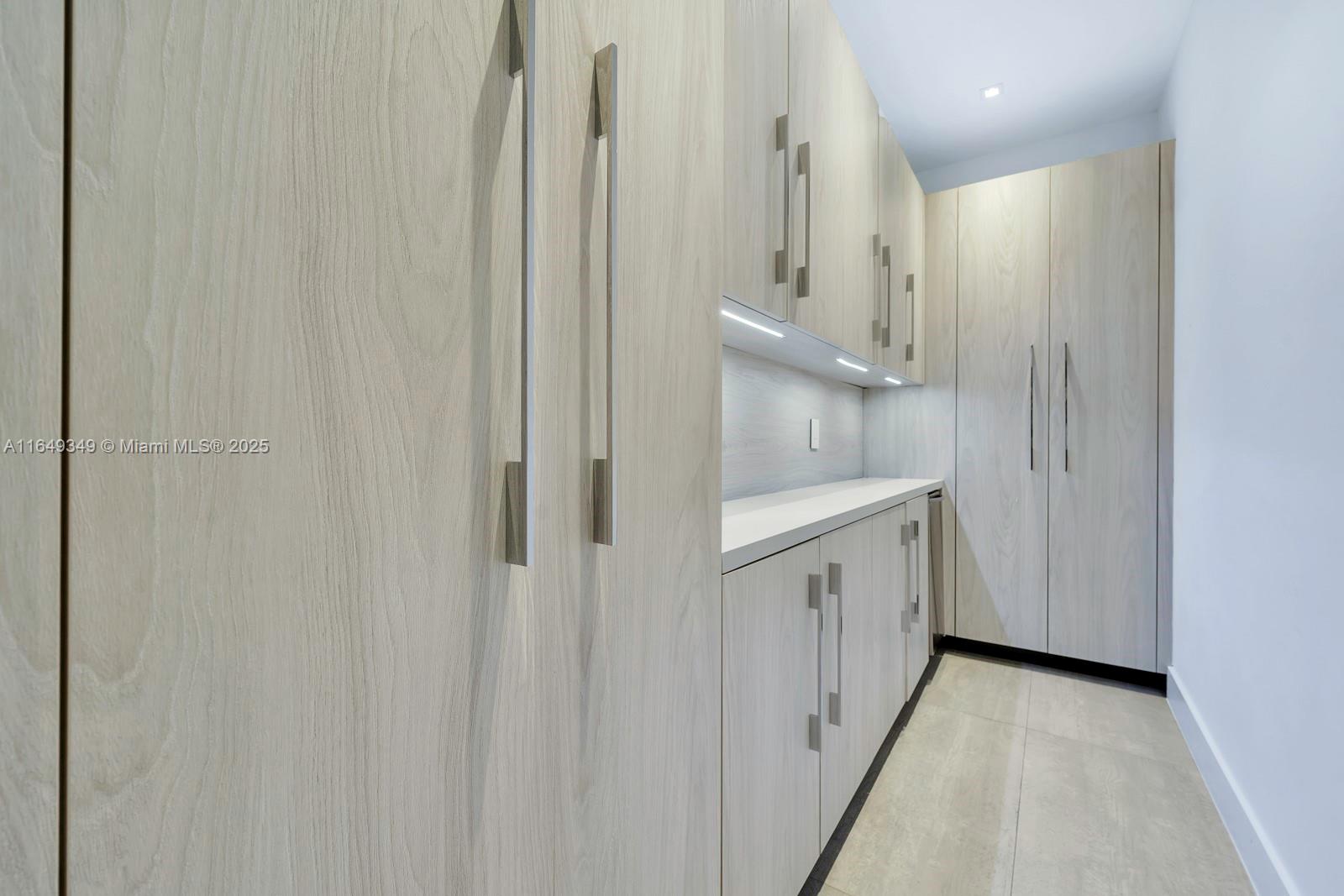 7900 Southwest 54th Avenue Miami, FL 33143 - Photo 25 of 63 a bathroom with a double vanity sink and a mirror