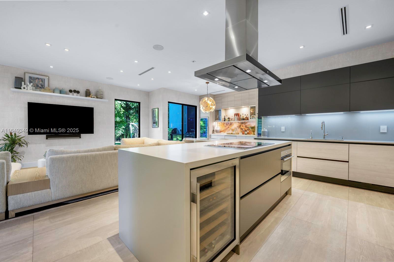 7900 Southwest 54th Avenue Miami, FL 33143 - Photo 27 of 63 a kitchen with stainless steel appliances a stove a microwave and white cabinets