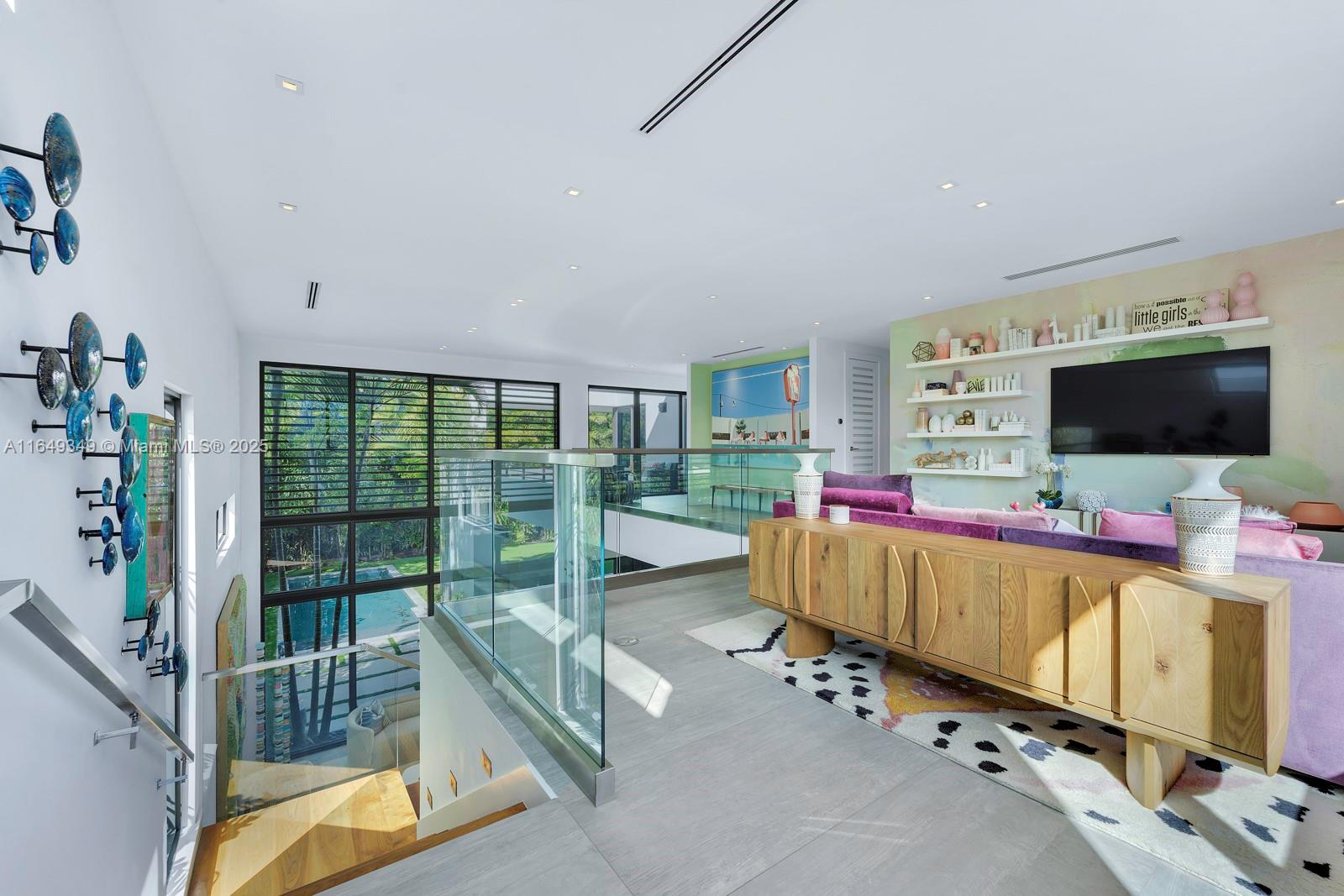 7900 Southwest 54th Avenue Miami, FL 33143 - Photo 29 of 63 a living room with furniture and a flat screen tv