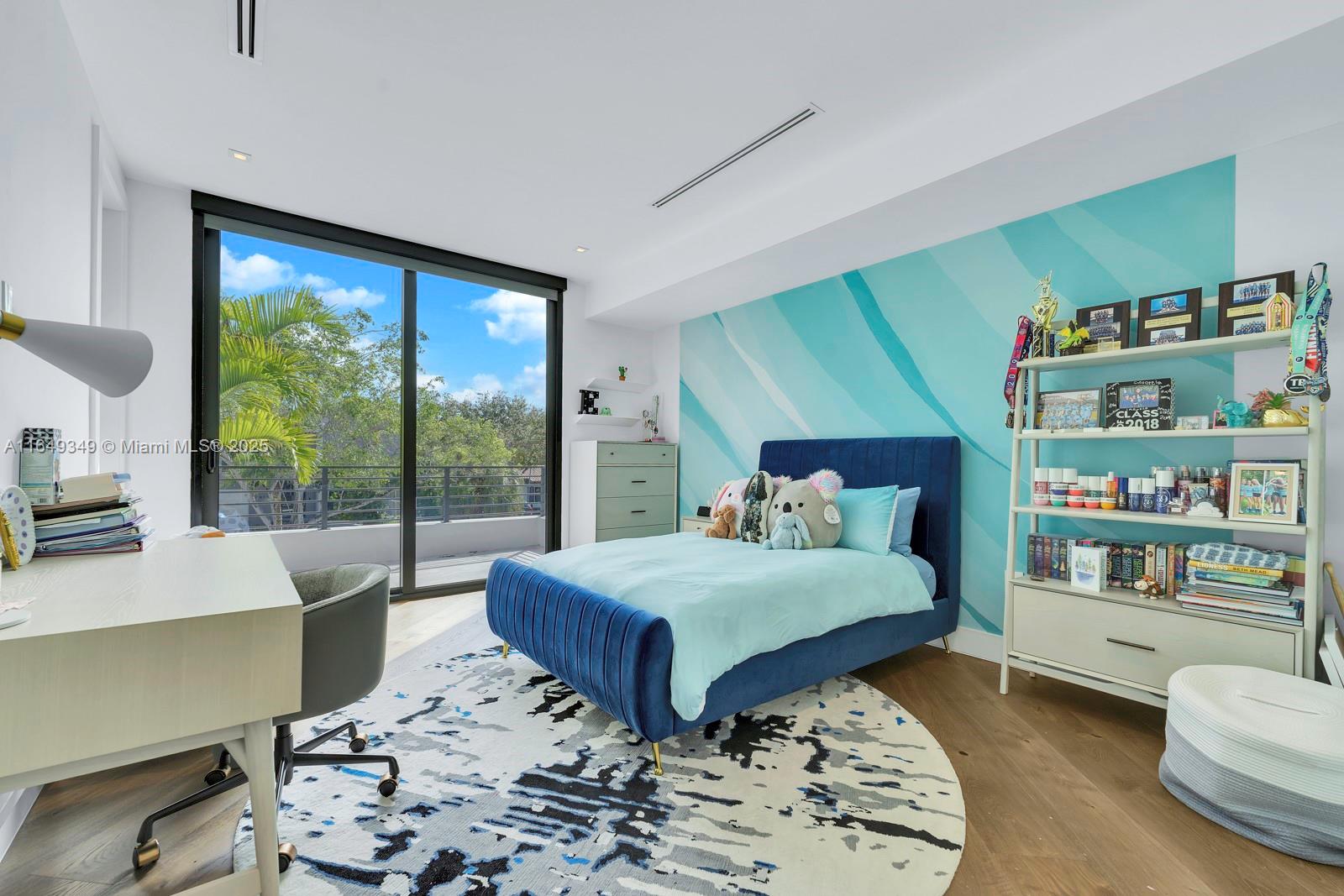 7900 Southwest 54th Avenue Miami, FL 33143 - Photo 33 of 63 a bedroom with a large bed and a large window